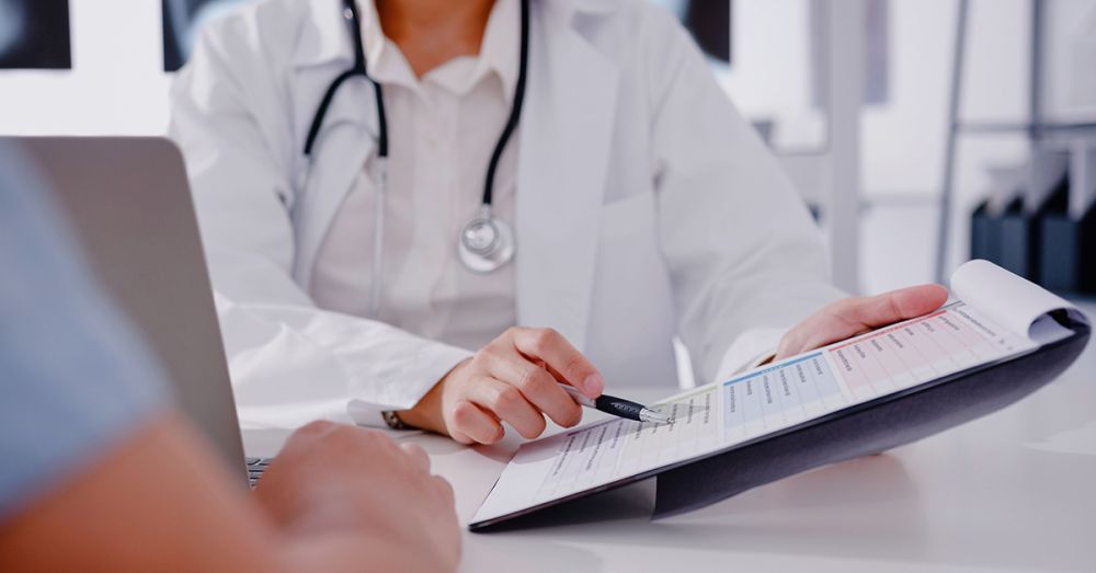 Tighter regulations blog teaser doctor looking at checklist