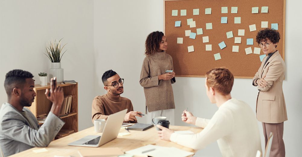 team planning actions on a board with sticky post-it notes